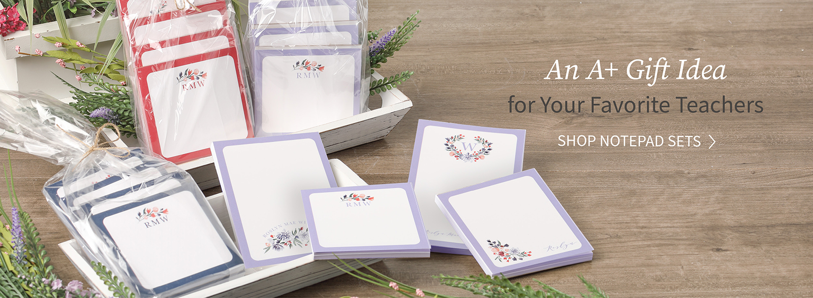 Packs of personalized notepads are shown in different colors with stylish designs as great gifts for teachers.